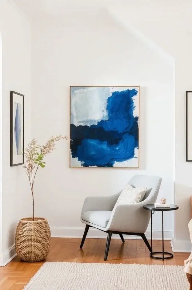 Gallery in a Nook - Transform an unused corner into an intimate gallery space. Select a bold, oversized print or an eclectic mix of smaller pieces that tell a story. Frame them in a way that respects their uniqueness, and use a small bench or pouf nearby for guests to pause and appreciate the art. This nook becomes a delightful retreat that invites exploration and conversation.